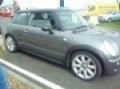 Becky driving a Mini Cooper S at Rockingham Speedwat