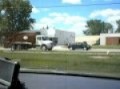 Car trucking Freightliner Mcneilus RL in traffic