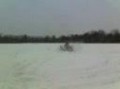 Jake on his kawasaki prairie 300 on some ice dougnuts fast