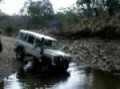 Land Rover Defender in whats left of a creek...