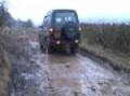 Meggy driving the landrover through some mud