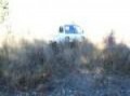Suzuki carry with Mattracks coming down creek bank