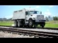 dump truck going up train track